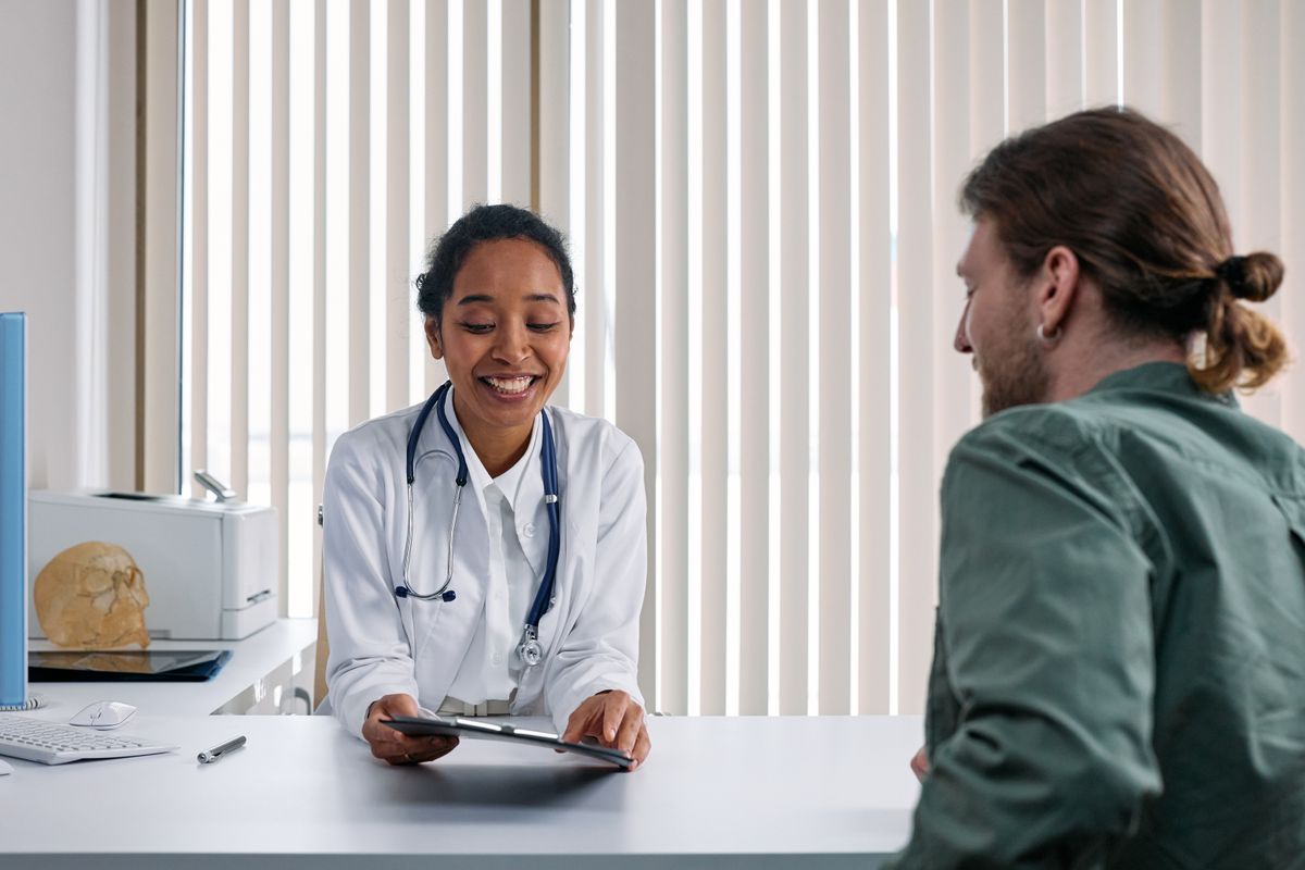 A clinician talking through a treatment plan with a patient